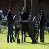 A cannon crew at Ft. Stanton prepares to fire during a special event.