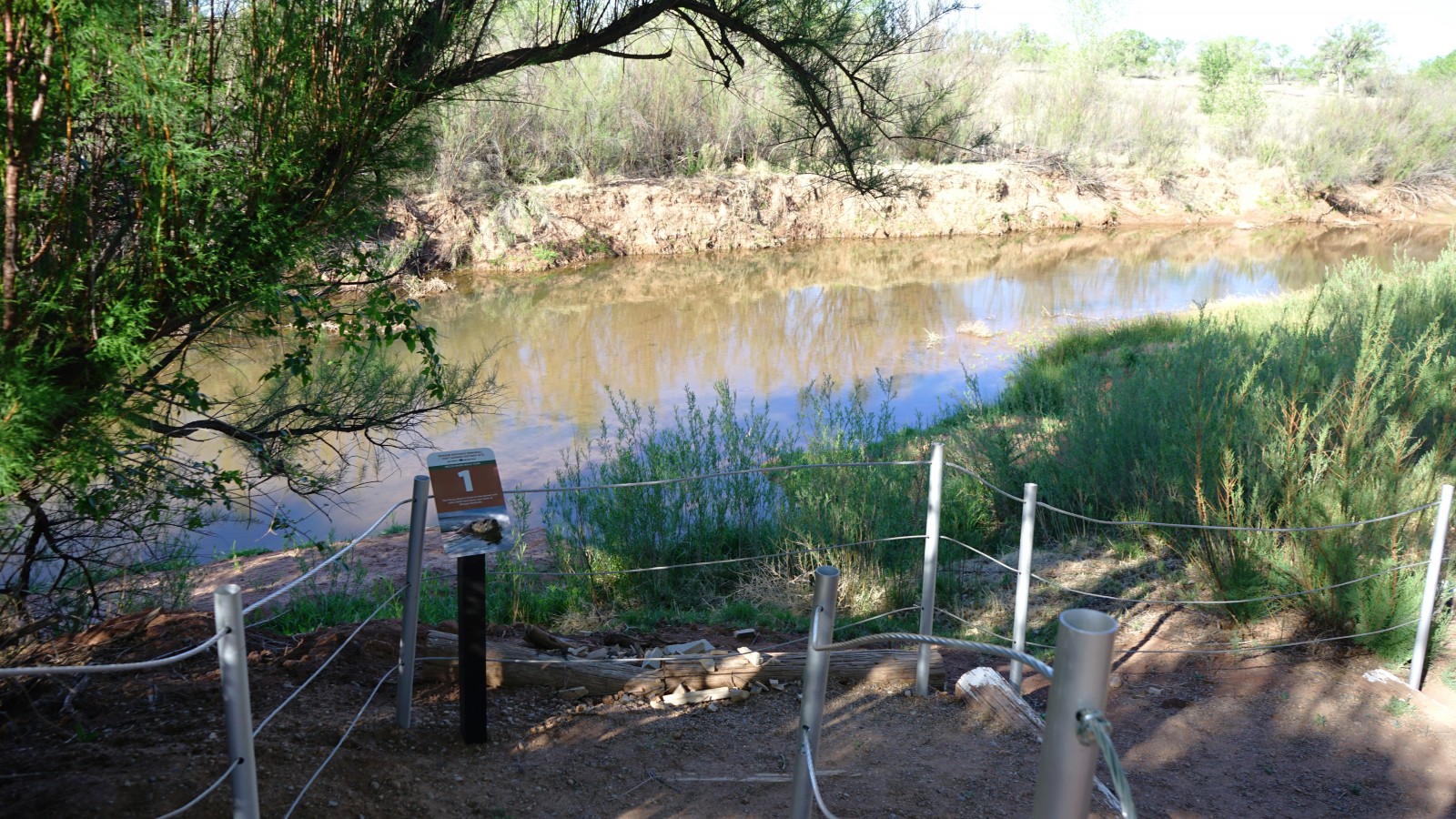 Bosque Redondo Memorial Natural Trail Audio Tour Stop 1 with Pecos River in the foreground.