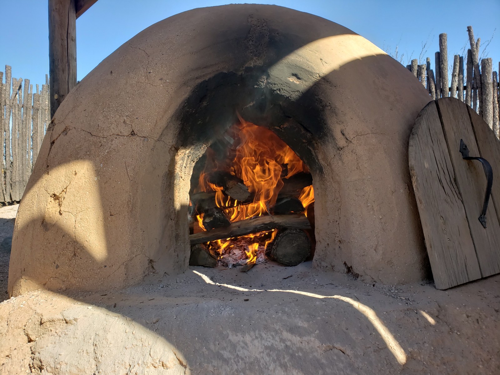 Fort Selden's working horno on display preparing to bake fresh bread.