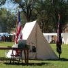 Tents set up for Fort Stanton Live in the parade ground.